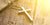 Silver cross necklace on display, available in Australia