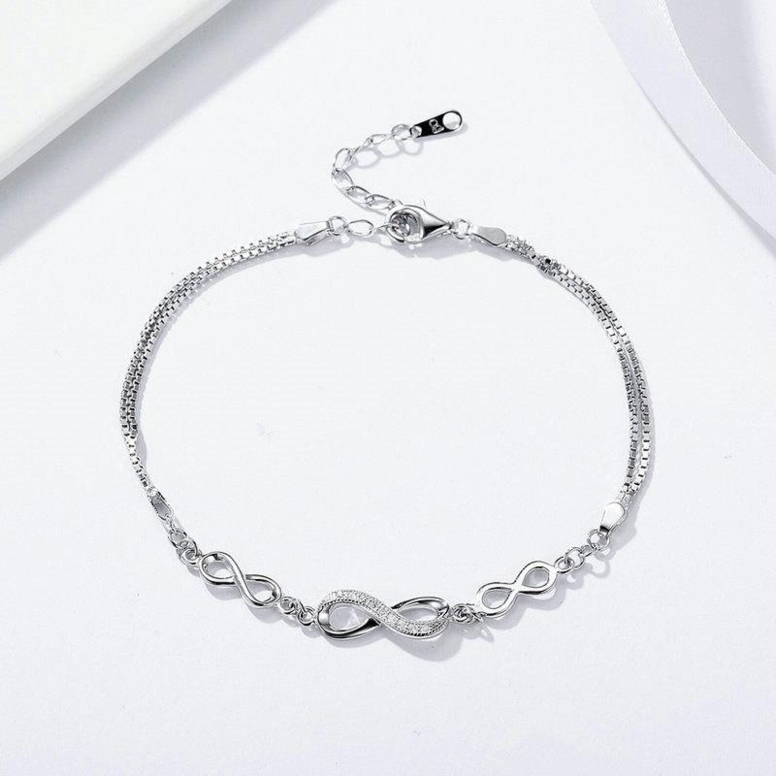 Silver infinity on sale bracelet womens